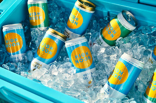 Modern corporate event space with chic lounge seating and warm lighting at The Dean NYC.