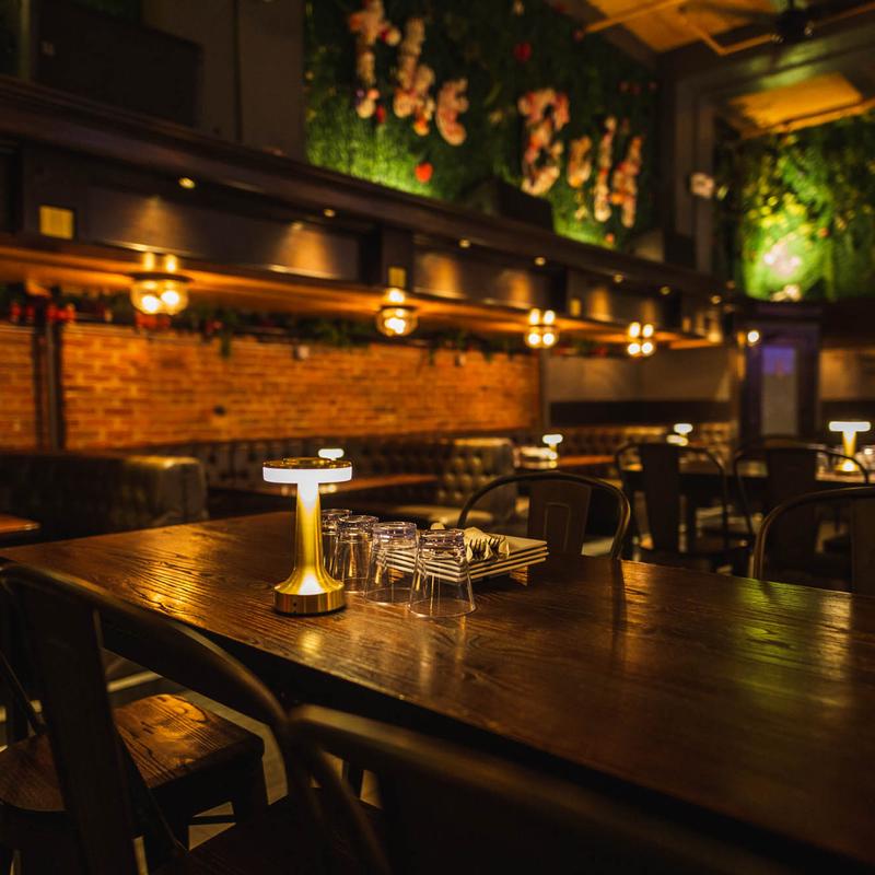 Trendy NYC birthday party venue at The Dean with modern interior design, stylish seating, and a vibrant social atmosphere.