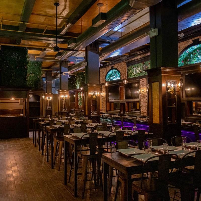 Luxurious private event room with stylish décor, ambient lighting, and spacious seating—perfect for hosting celebrations in one of the best private party spaces.